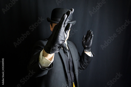 Portrait of British Gentleman in Dark Suit With Hands Raised in a Karate Pose. Gentleman of Action. Defender of Honor. Sartorial Splendor in the Face of Thuggery. © jeremyimagery.com