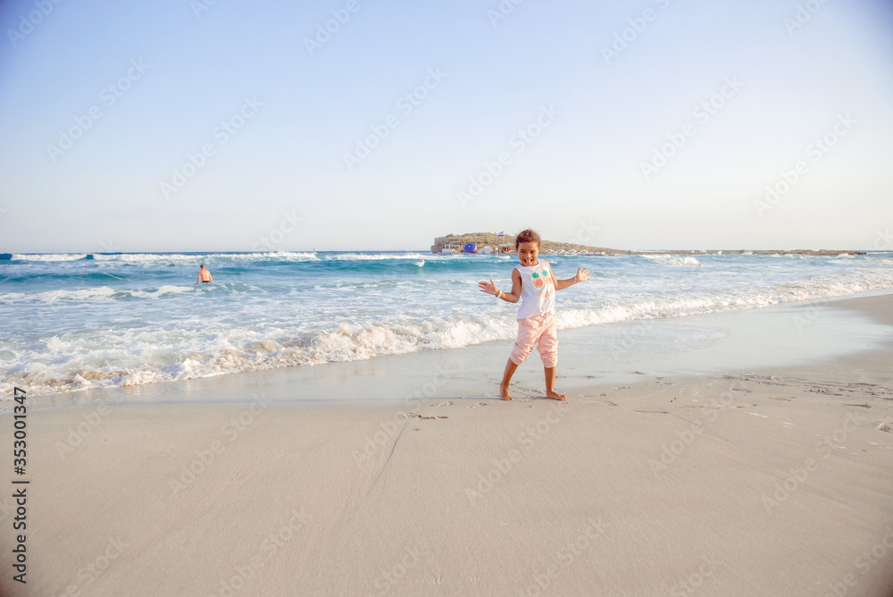 happy little girl have fun and joy time at beautiful beach happy little girl have fun and joy time at beautiful beach