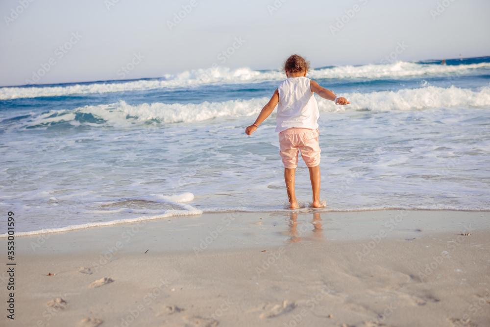 happy little girl have fun and joy time at beautiful beach happy little girl have fun and joy time at beautiful beach