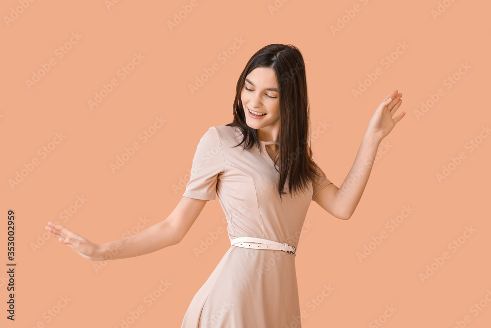 Beautiful young woman dancing against color background Beautiful young woman dancing against color background