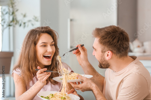 Happy young couple having l...