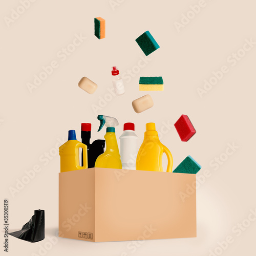 Home cleaning products in cardboard box. Cleaning concept.