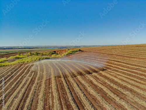 Soil treatment in sugarcane plantation. vinhoto nutritive substance , aerial view