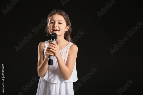 Cute little girl singing ag...