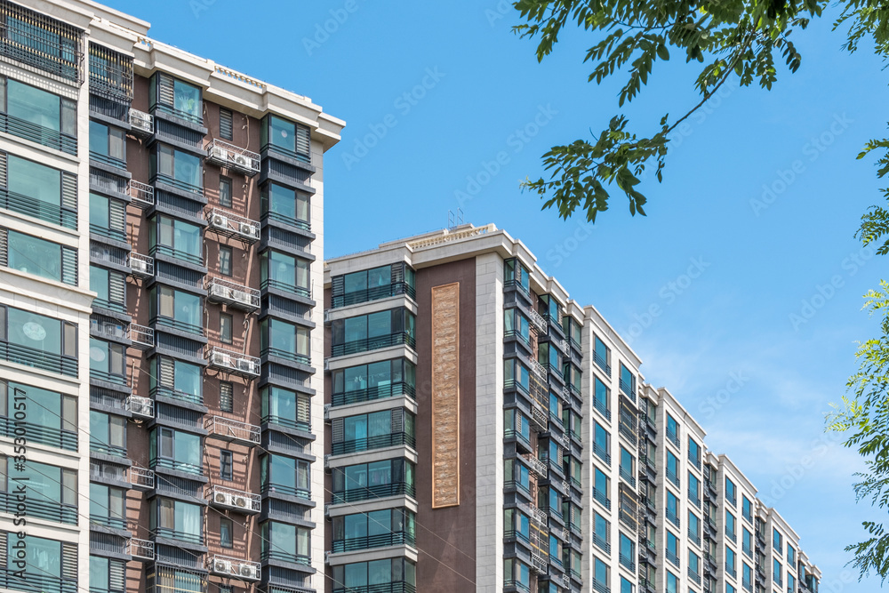Residential area under blue sky and white clouds
Residential area under blue sky and white clouds