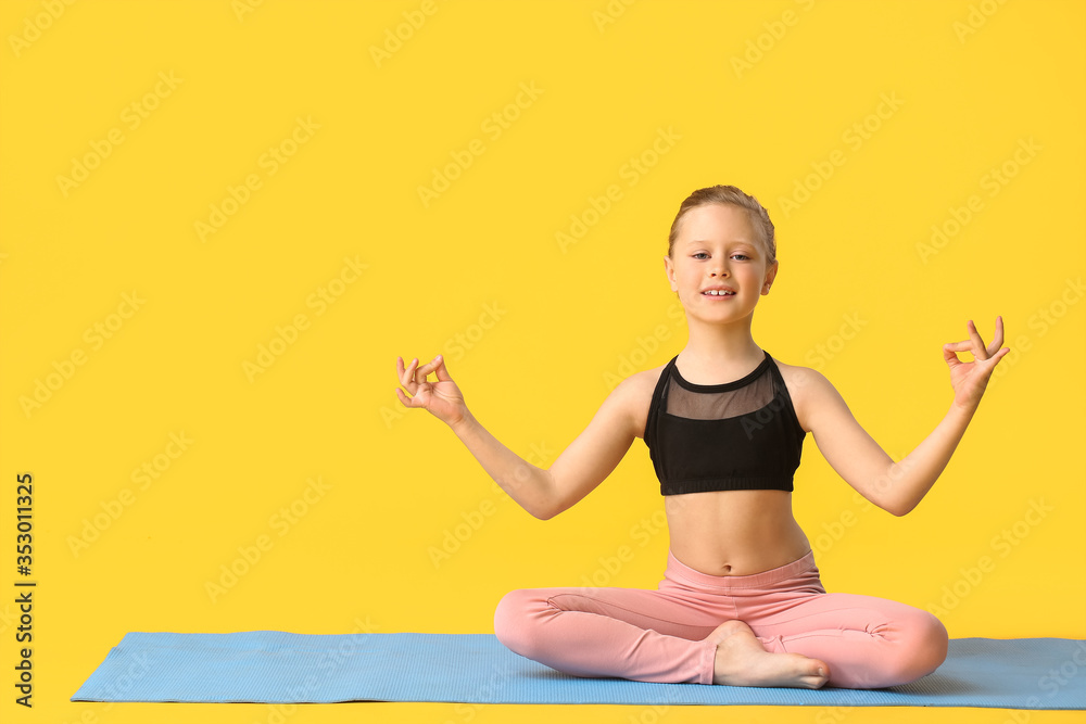 Little girl practicing yoga on color background Little girl practicing yoga on color background