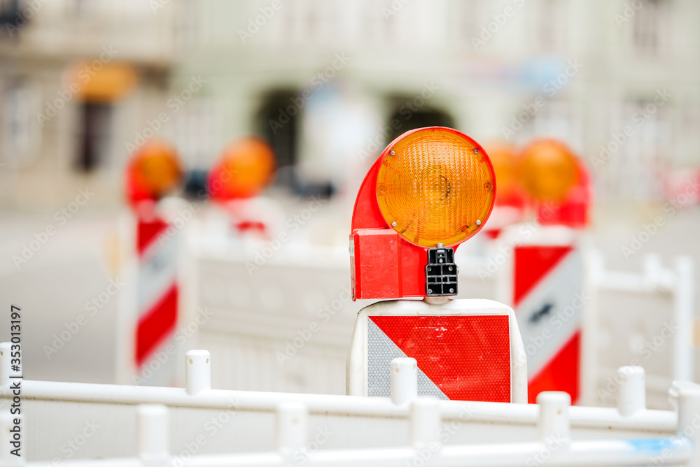 Fototapeta premium Construction site lock with signal lamp on a road.