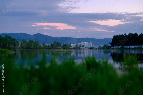 pink sky and white houses on the river Bank © Viktor