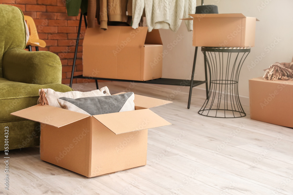 Cardboard boxes with belongings in new flat on moving day Cardboard boxes with belongings in new flat on moving day