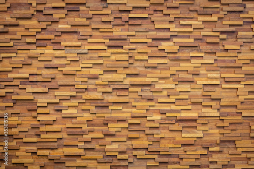 Stack of wooden wall brown color background.