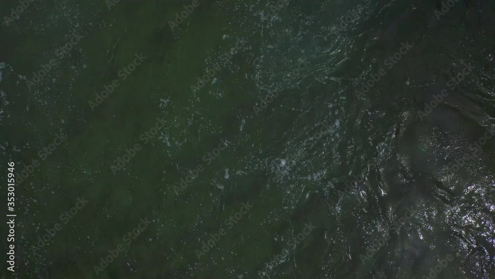 Aerial: High angle view of green river on sunny day, drone flying over water - Krka, Croatia Aerial: High angle view of green river on sunny day, drone flying over water - Krka, Croatia