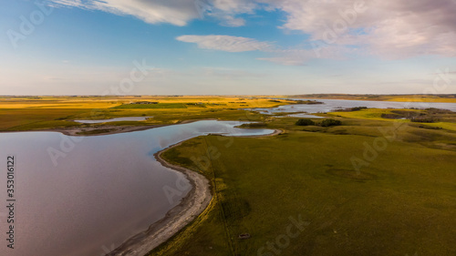 An aerial view of a calm secluded lake in the prairie province of Saskatchewan, Canada