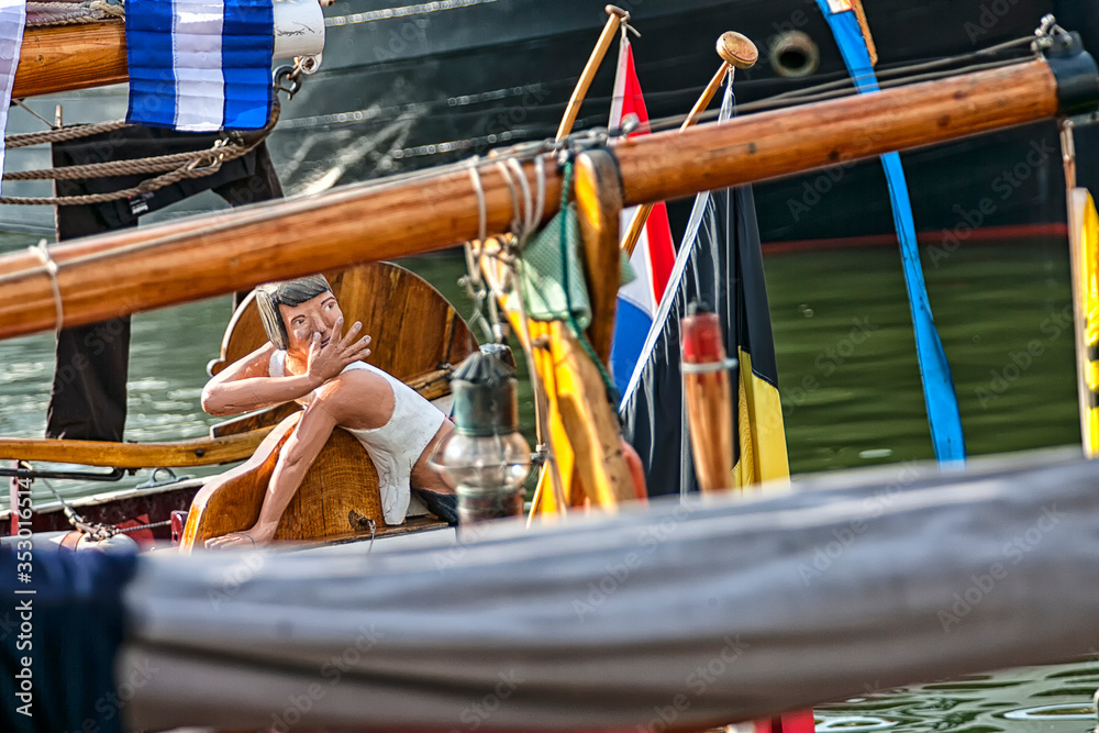 Old wooden sailing ship. Old wooden mast with sails. Sailing ship. Ships' rope on old boat. Wooden block and ropes. Old wooden sailing ship. Old wooden mast with sails. Sailing ship. Ships' rope on old boat. Wooden block and ropes.