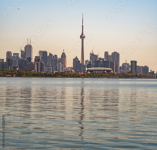 Panoramic view of Toronto skyline over the Ontario Lake during the golden hour, Canada 