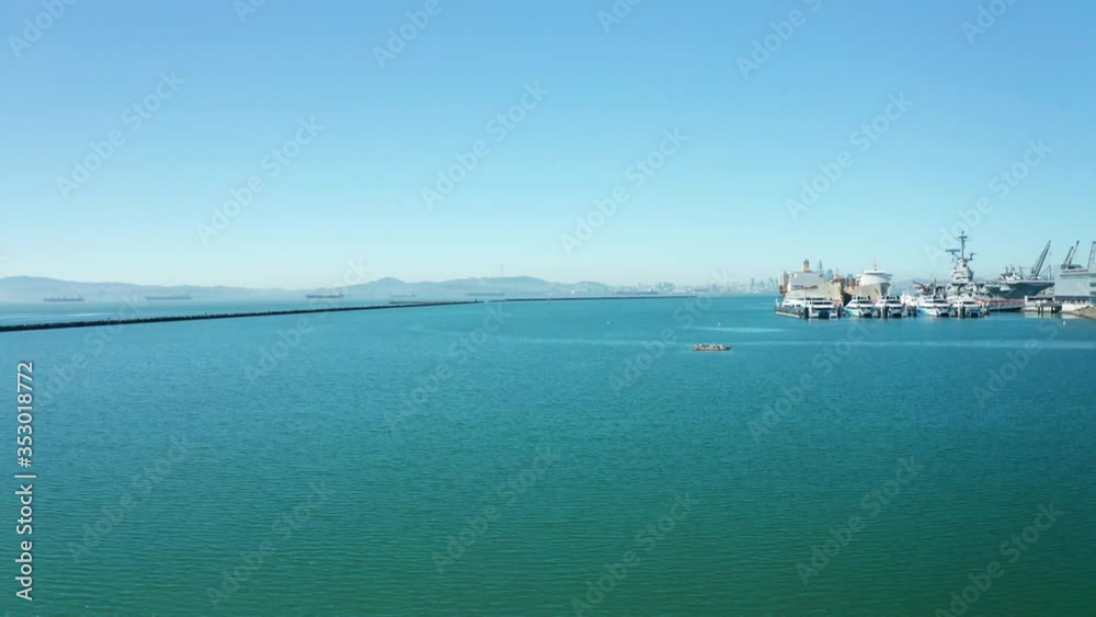 The blue skies and deep green sea under the urban city. The blue skies and deep green sea under the urban city.