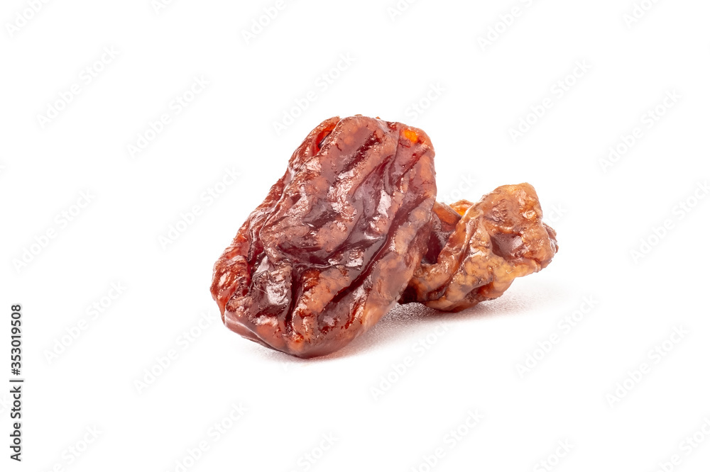Close up dried raisins isolated on white background.
