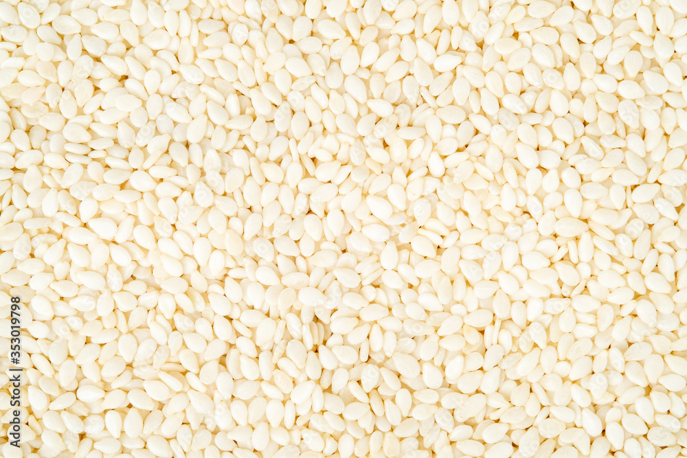 Roasted white sesame seeds background. Roasted white sesame seeds background.