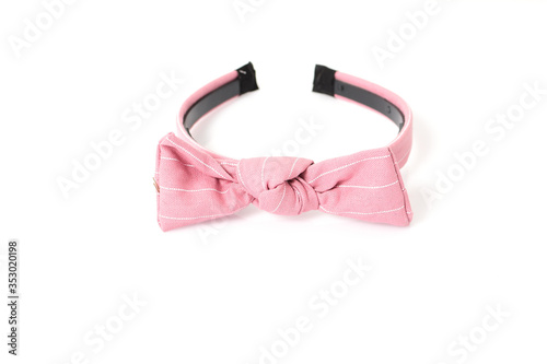 Pink hair band with ribbon isolated on white background, fashion hairstyle for girl. Hairdresser accessory and decoration for clothing and costume.