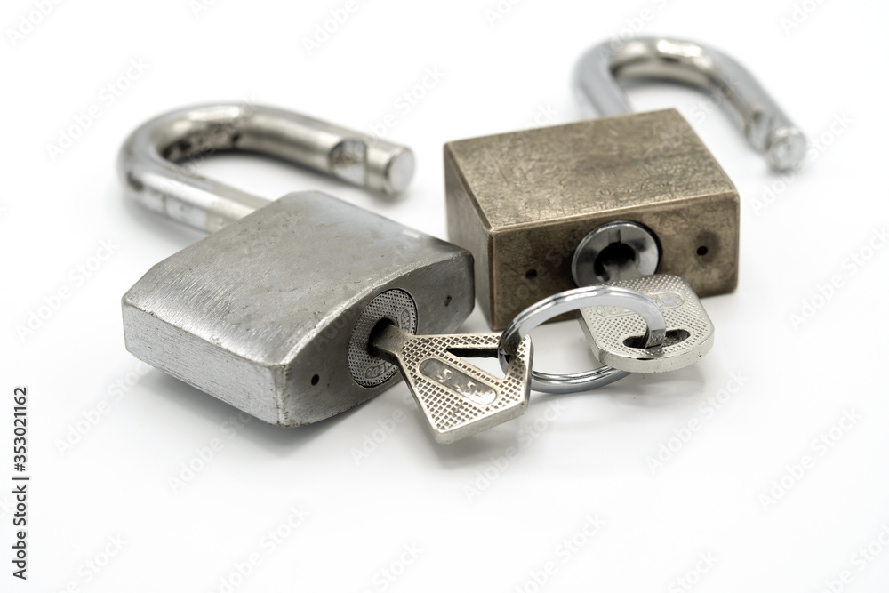 two security gold locks in a row isolated on white background. two security gold locks in a row isolated on white background.