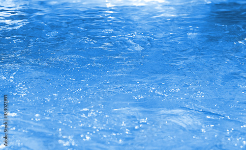Water in swimming pool rippled water detail background. Vintage Water bokeh background. Bokeh blue  boke  background pattern.