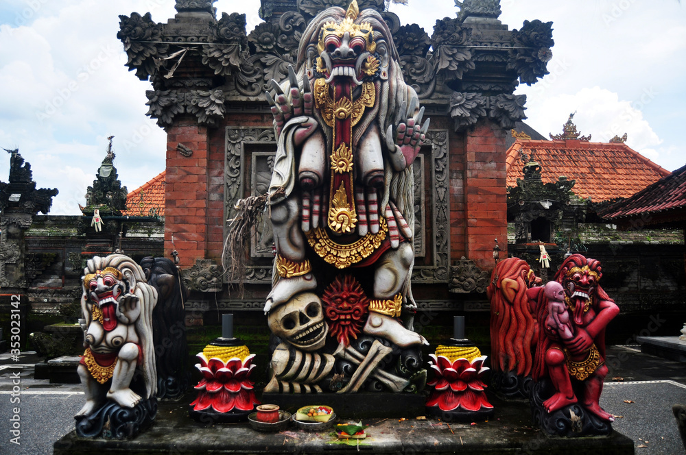 Art sculpture and carved antique deity angel god of hindu statue balinese style in Pura Ulun Danu Bratan or Pura Bratan Hindu Shaivite Shiva temple in Bratan near Bedugul in Bali, Indonesia