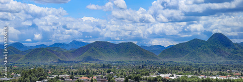 landscape sky clouds and mountains and village view nature background in lamphun Thailand © prapann