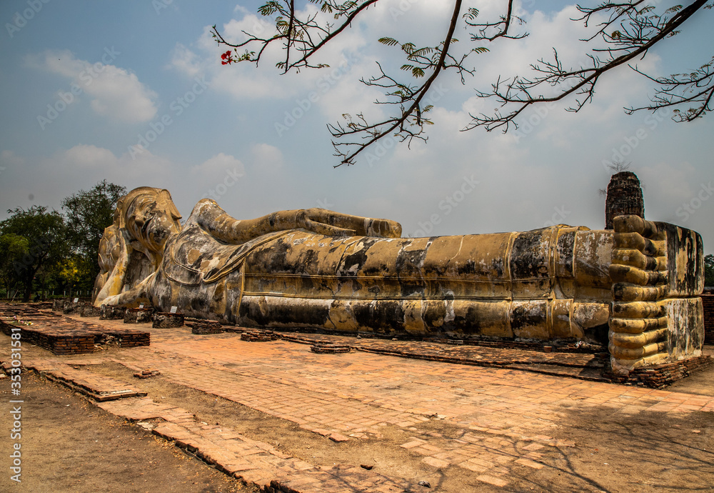  lying buddha in Wat Lokkayasutharam (Phra Buddha Sai Yat), a Buddhist temple of archaeological park, Ayutthaya, Thailand