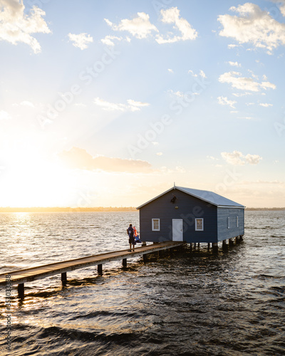 Man watching the sunrise at the Blue Boat House in Perth.  © Sky Perth