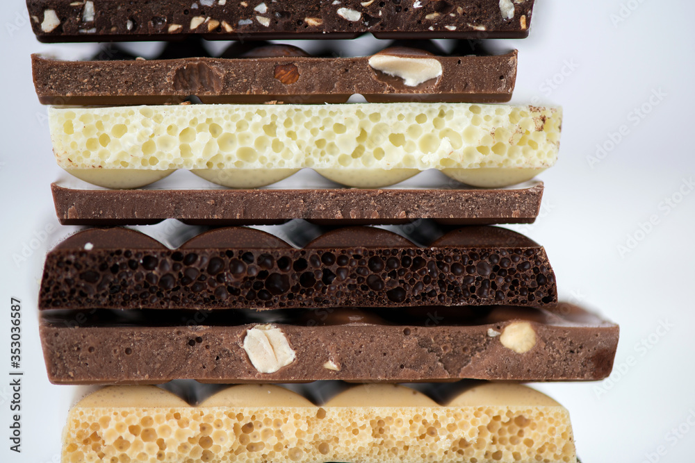 Different kinds of chocolates with nuts cocoa powder and mint Different kinds of chocolates with nuts cocoa powder and mint