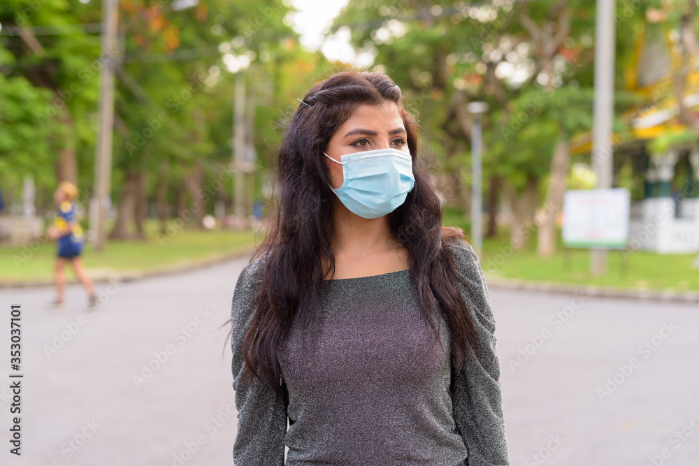 Young Indian Woman With Mask Thinking At The Park Outdoors Stock Photo 