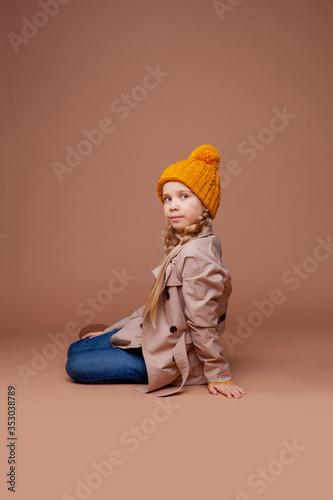 cute long-haired girl in autumn clothes (cloak, warm hat) © Julie Boro