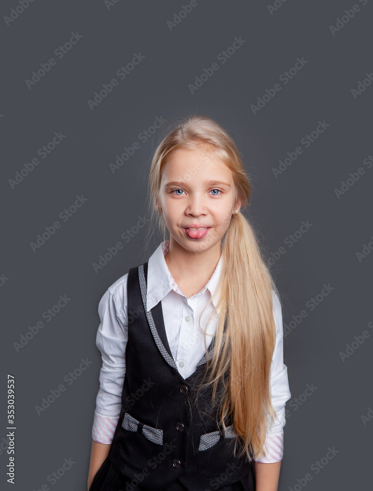 cute schoolgirl on a dark gray background cute schoolgirl on a dark gray background