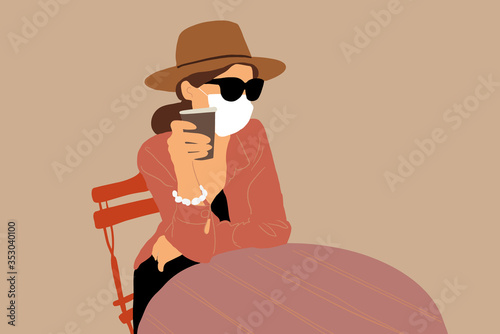 Woman in facial protective mask at the cafe outdoors