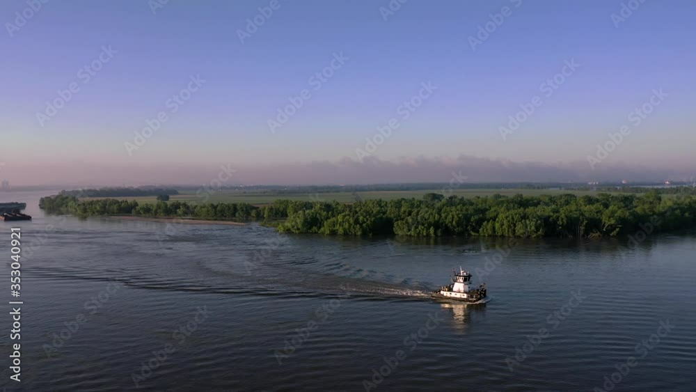 Pushboat on a river in Burnside, Louisiana aerial view Pushboat on a river in Burnside, Louisiana aerial view