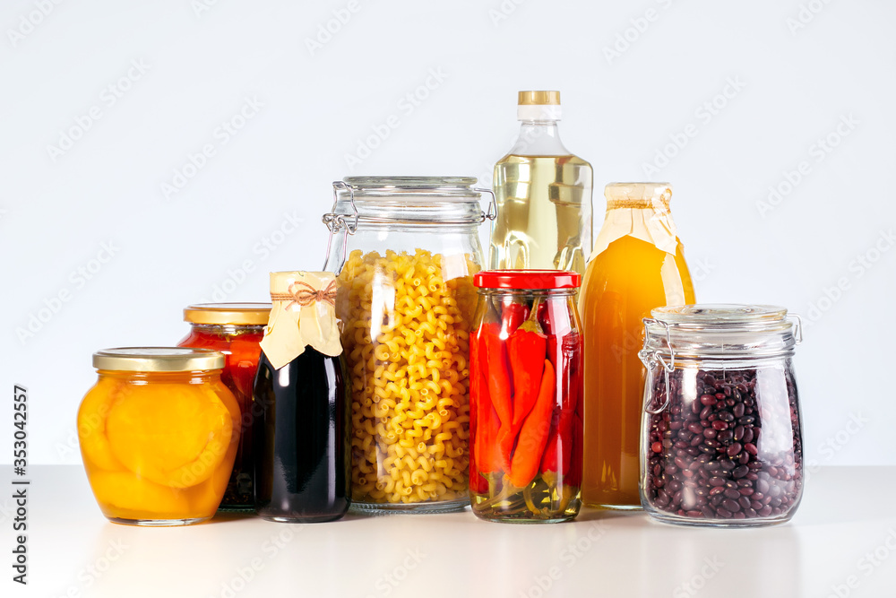 Canned food, drink in various cans and bottle on table. Donate concept. Food supplies crisis food stock. Canned food, drink in various cans and bottle on table. Donate concept. Food supplies crisis food stock.