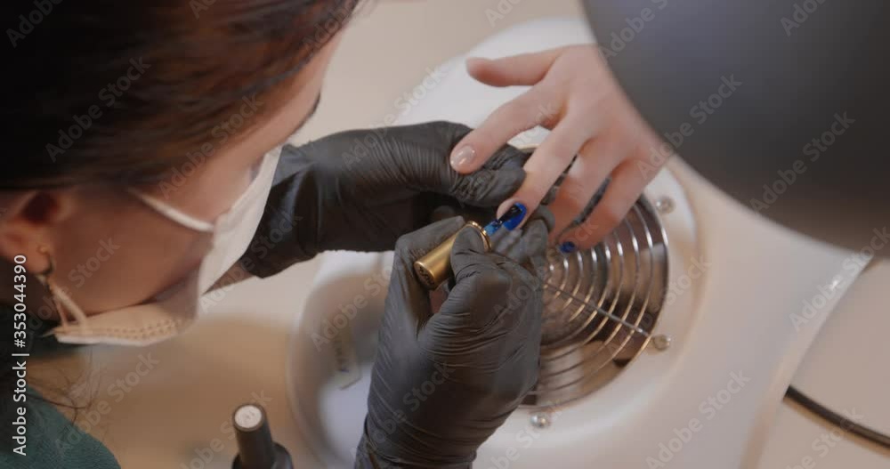 Professional Manicurist works on nail of client in beauty saloon. Close up. Women painted nails.Manicure Art close up. Beautiful Nail Art Manicure.Manicure nail paint. Spa. Hand care. 4K Professional Manicurist works on nail of client in beauty saloon. Close up. Women painted nails.Manicure Art close up. Beautiful Nail Art Manicure.Manicure nail paint. Spa. Hand care. 4K