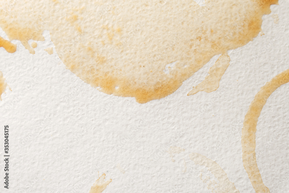 Abstract liquid drops splash brown coffee on a white texture paper background for watercolor. Artistic decoration or backdrop. Banner for text, grunge element. Abstract liquid drops splash brown coffee on a white texture paper background for watercolor. Artistic decoration or backdrop. Banner for text, grunge element.