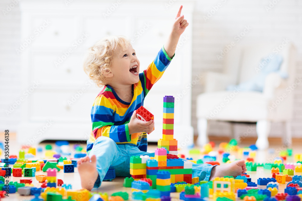Child playing with toy blocks. Toys for kids. - obrazy, fototapety, plakaty 