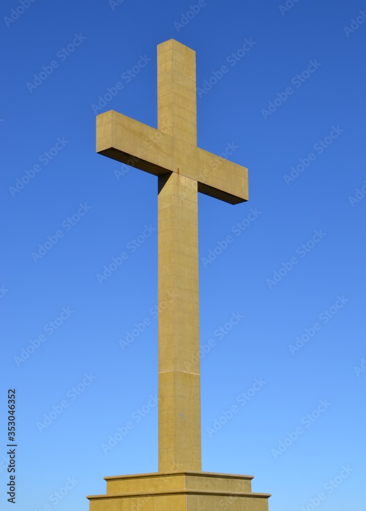 Cross on the hill with blue sky background