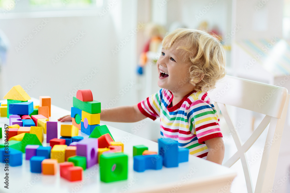 Kids toys. Child building tower of toy blocks. Kids toys. Child building tower of toy blocks.