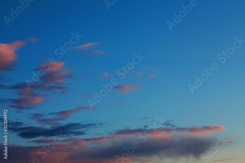 Dramatic sunset colorful cloud background. Amazing bright evening sky in city