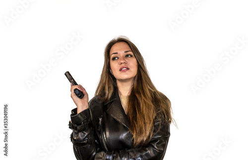 young girl with brown hair and green eyes with a gun