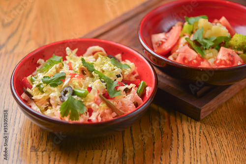 Vegetable salad with tomatoes, pepper, cucumbers, cabbage and mushrooms. Fresh organic veggies. Vegan, vegetarian diet.