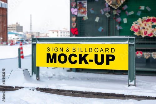 Mock up outdoor signboard on walkway near building