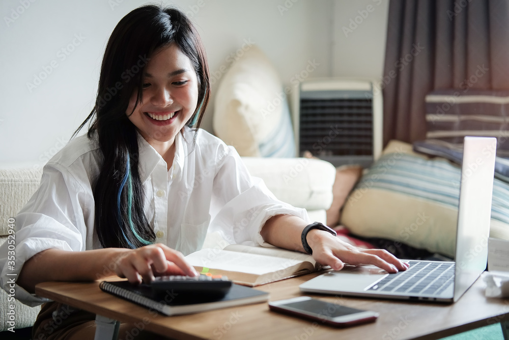 Business women work from home living room enjoying sunny morning on the day with documents and laptop people Consulting and business planning. Business women work from home living room enjoying sunny morning on the day with documents and laptop people Consulting and business planning.