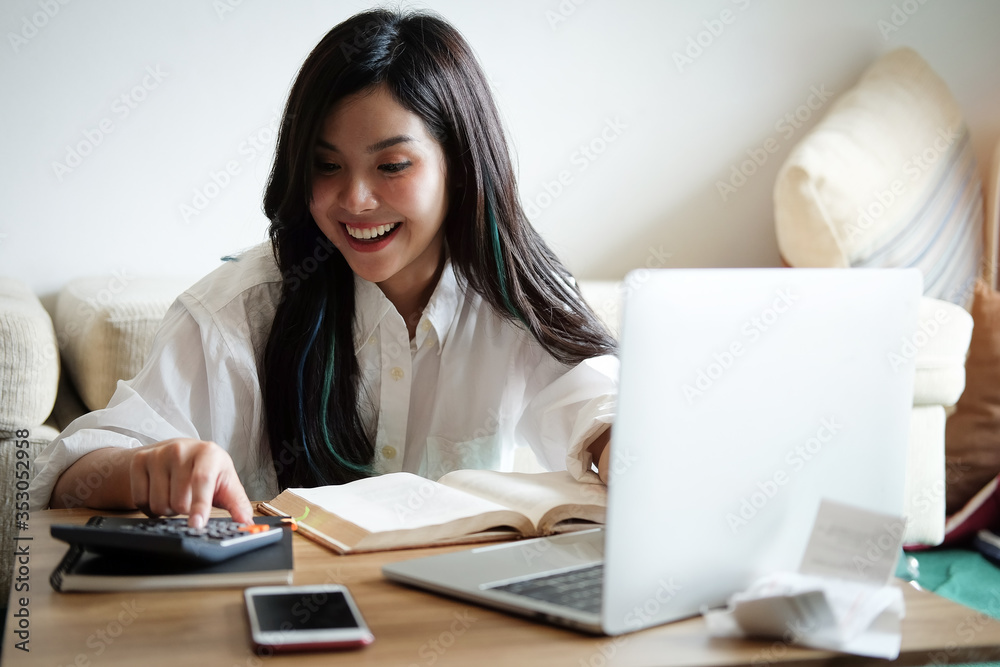 Business women work from home living room enjoying sunny morning on the day with documents and laptop people Consulting and business planning. Business women work from home living room enjoying sunny morning on the day with documents and laptop people Consulting and business planning.