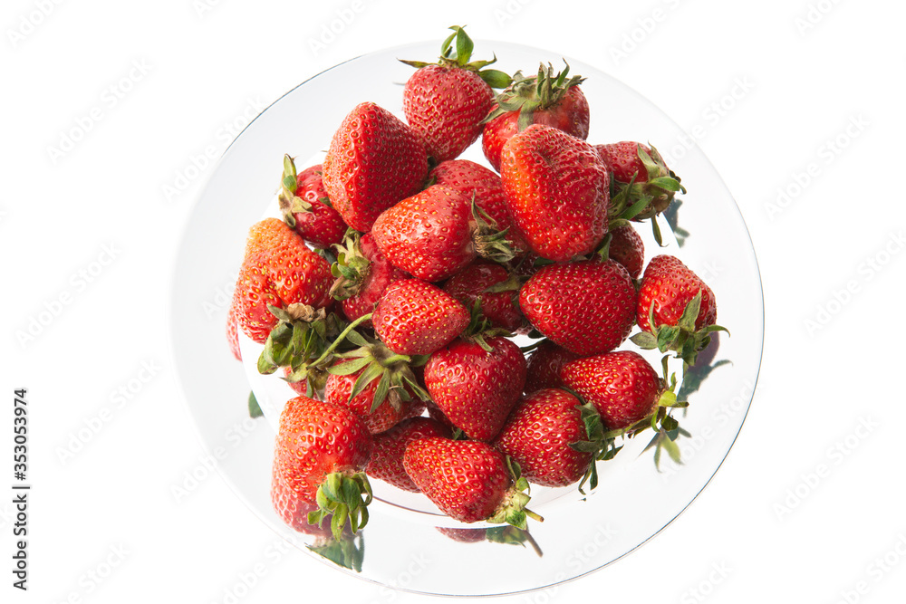 Strawberries in a silver plate isolated on white Strawberries in a silver plate isolated on white