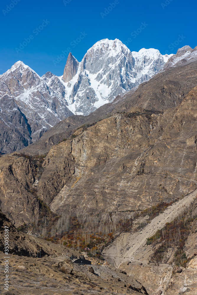 Ultar Sar mountain and Lady Finger mountain peak in Hunza valley in autumn season, Gilgit Baltistan, Pakistan