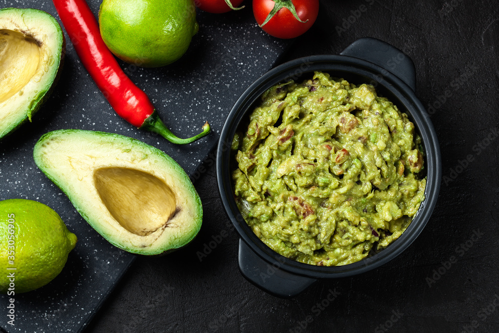 Bowl of guacamole with fresh ingredients Bowl of guacamole with fresh ingredients