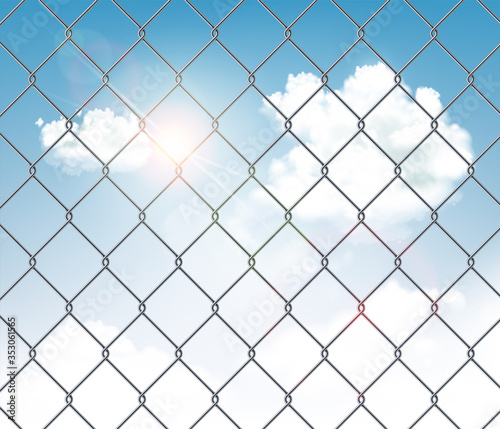 Fence made of metal wire mesh with a blue sky